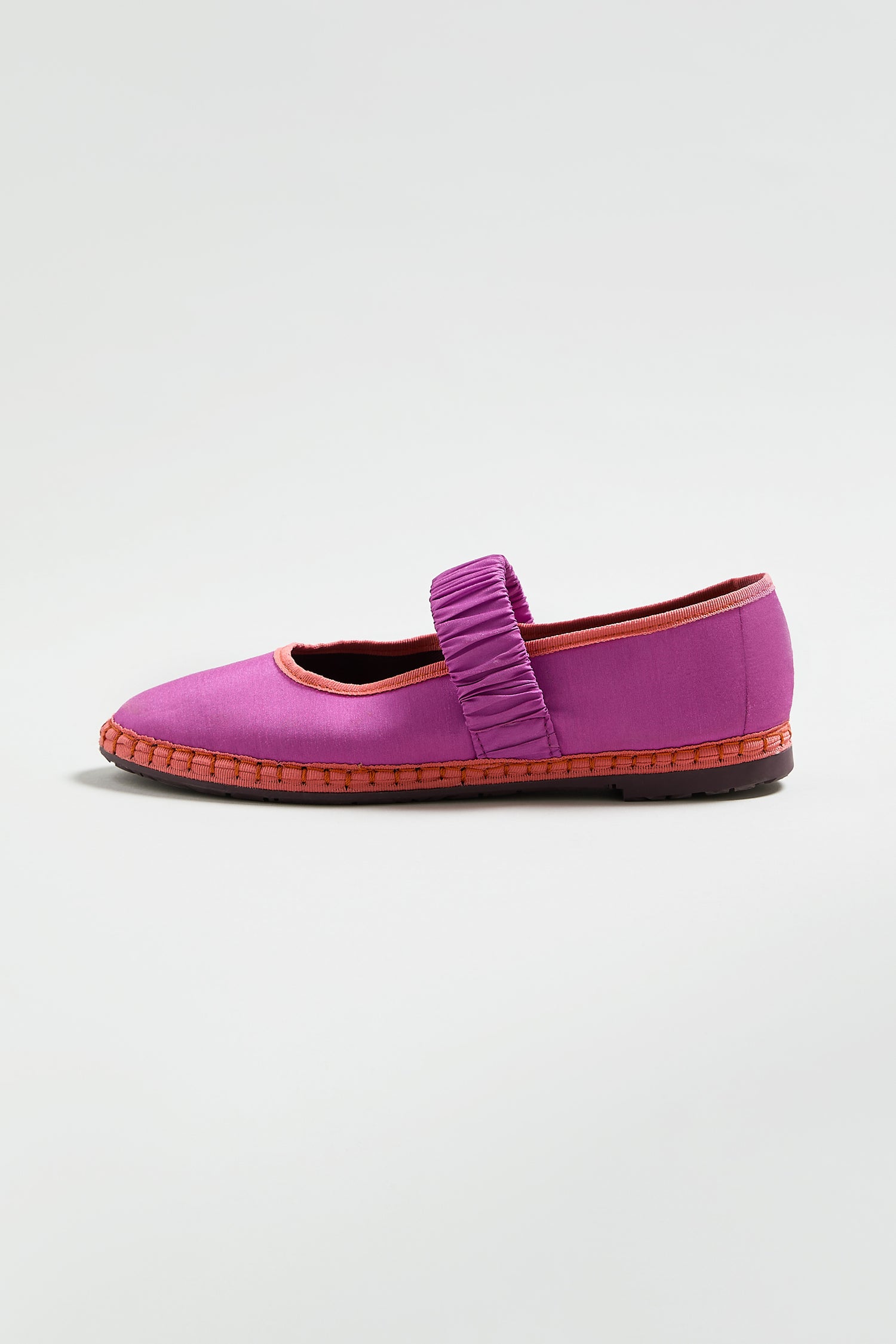 A single purple Mafalda Silk Shoe with a ruched strap and red trim, displayed on a white background. This FLBMAFALDAS online exclusive flat adds a pop of color to any outfit.