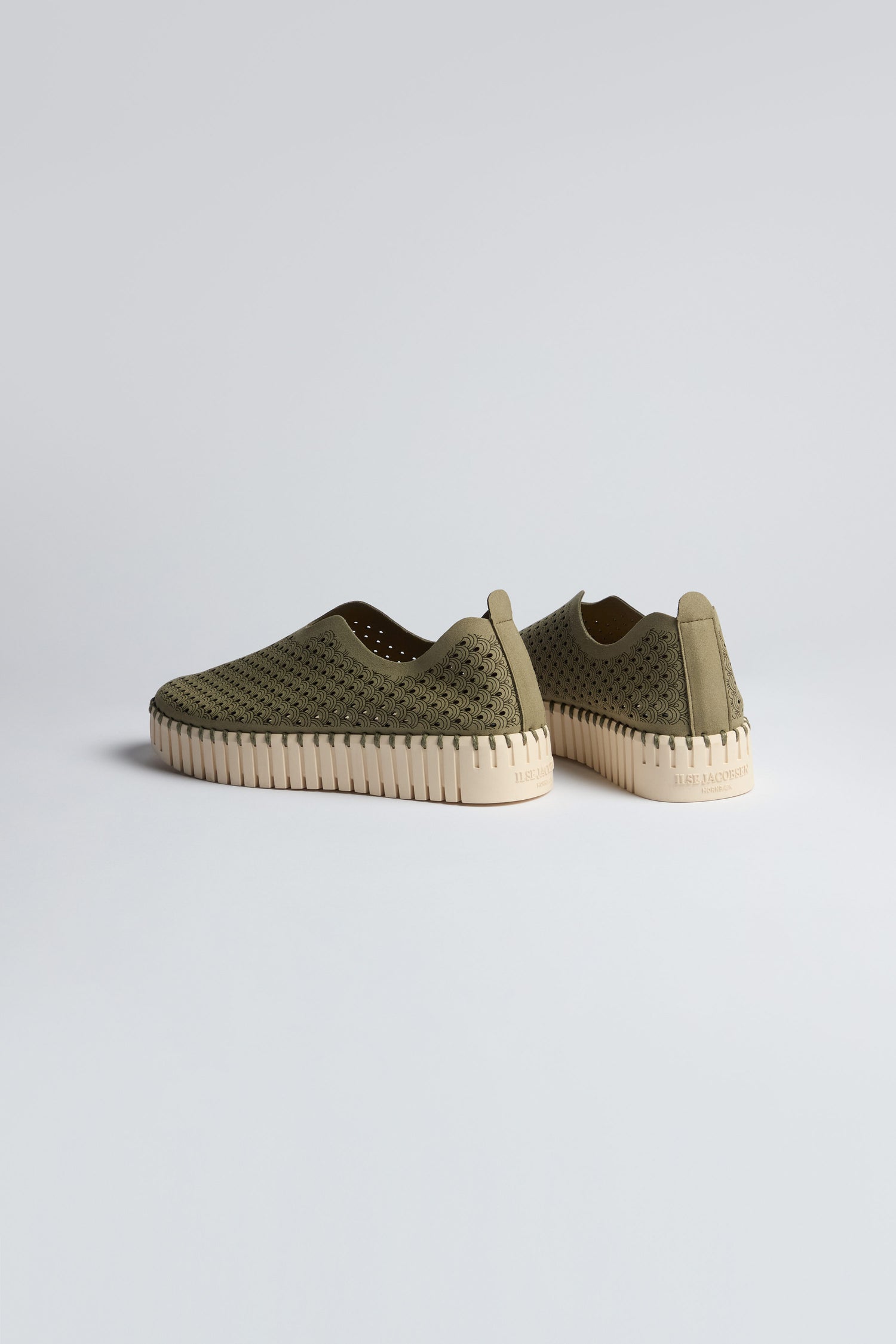 Two Khaki Tulip Platform Slip On Shoes are shown on a plain light background, angled to display their perforated uppers and beige ribbed soles, highlighting both the sides and backs.