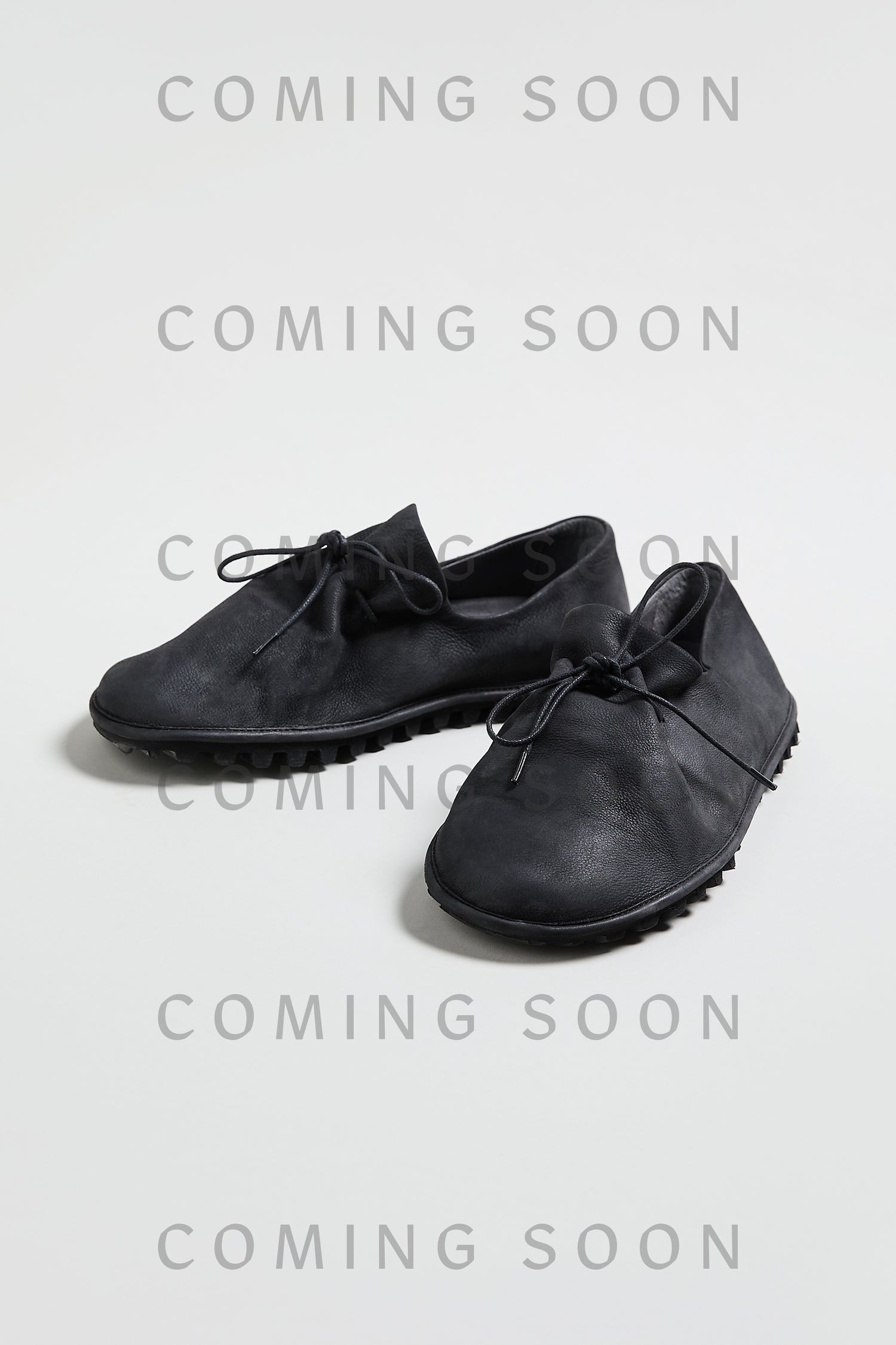 A pair of Crushed Leather Lace Up Shoes, style LOFI9944-SS26 in black, is displayed on a light surface with "COMING SOON" repeatedly overlaid on the image.