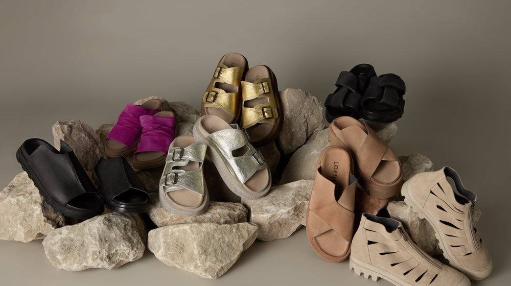 A group of different types of shoes on a white background.