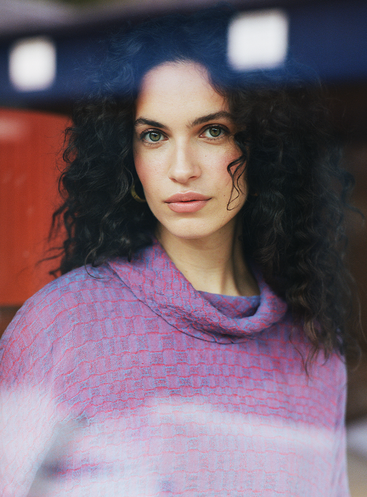 woman wearing purple top