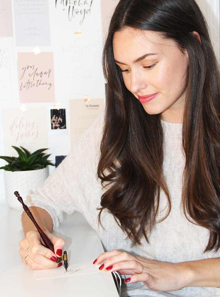 woman writing a christmas note