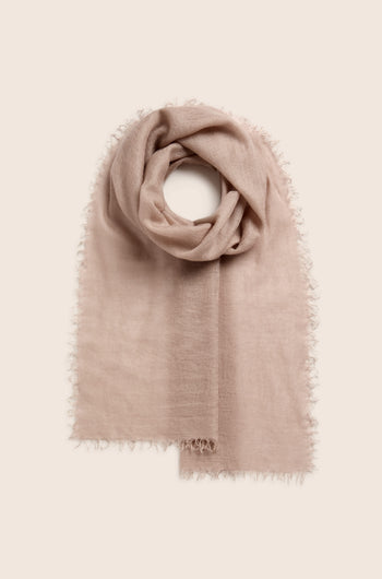 Soft Weave Cashmere Scarf in beige, featuring a raw-edge tassel finish and folded in a loop on a light background.