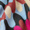 Close-up image of the Retro Waves Wool Mix Scarf featuring an abstract pattern in red, blue, white, and black colors, reminiscent of a vintage style.