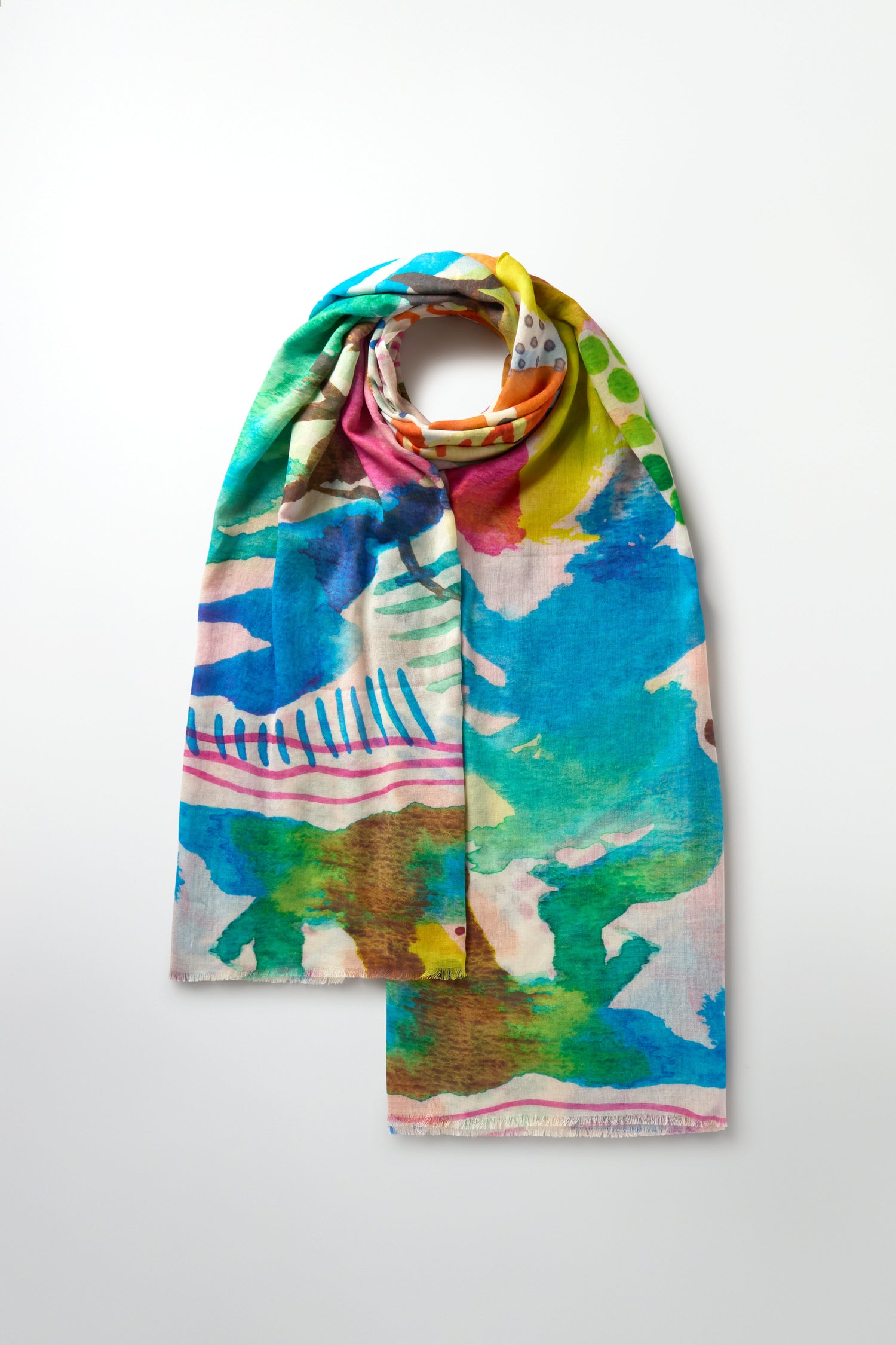 The Summit Cotton Modal Scarf features a lively abstract design on a solid background, combining the airy comfort of a cotton-modal blend.