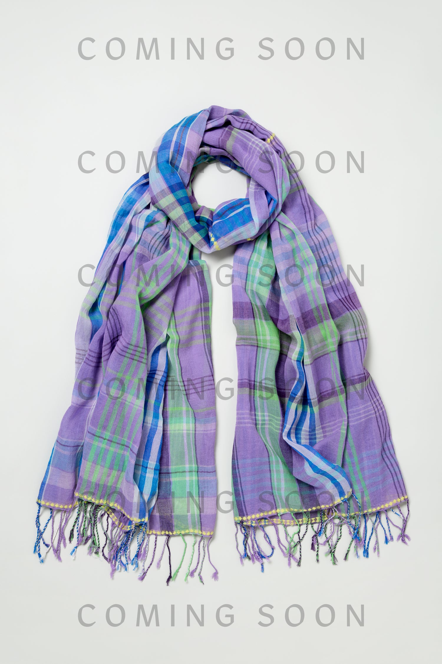 Embroidered Colour Pop Check Cotton Scarf in purple, green, and blue plaid with fringe ends, shown flat. "COMING SOON" and product code AHUIT52067 overlay the image.