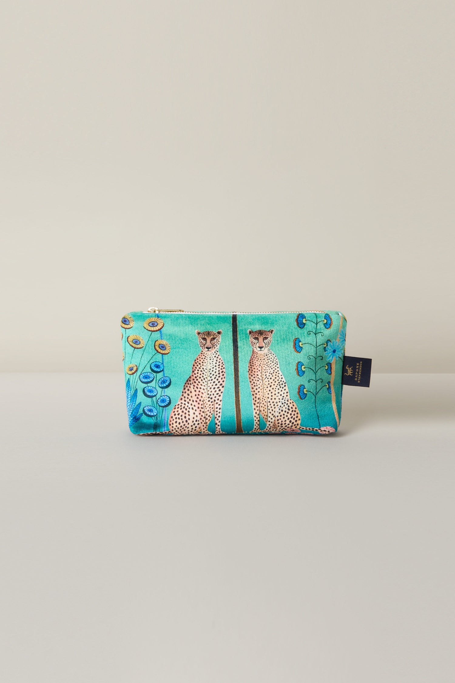 The "Small Sunshine Through My Window Velvet Bag" features a turquoise background with two cheetahs amid a vibrant floral design.