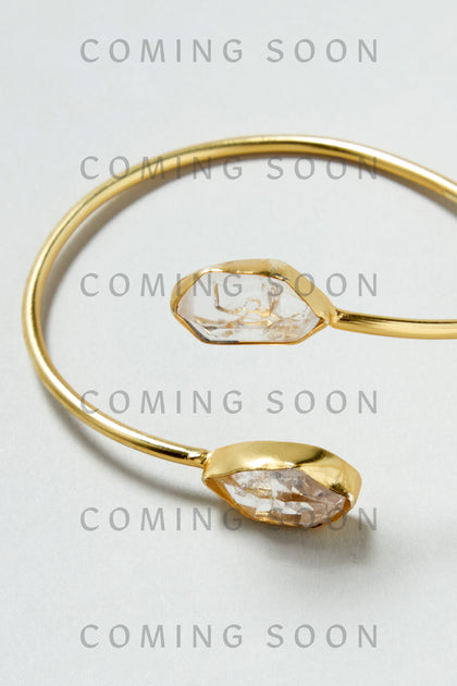 Gold Plated Quartz Herkimer Diamond Bracelet with two clear crystals on each end displayed on a light background; overlaid text reads "COMING SOON.