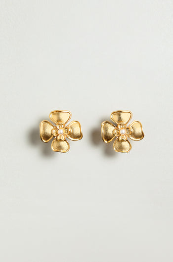 The Gold Plated Flower Pearl Earrings feature a floral design with a delicate pearl center, shown against a plain light background.