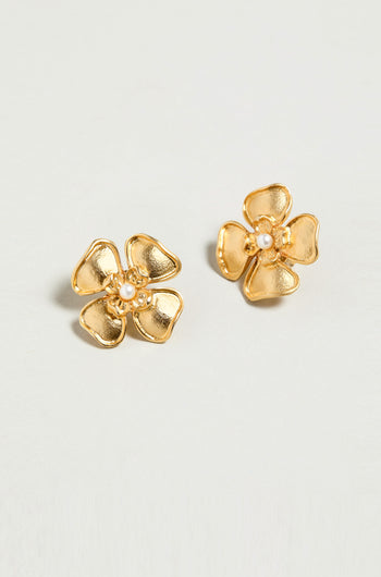 Gold Plated Flower Pearl Earrings: Floral-shaped studs with a delicate pearl center, crafted in gold plating and displayed on a simple light background.