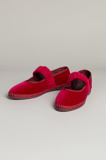 The Mafalda Fuchsia Velvet Shoes feature elastic ruched straps and visible stitching on a recycled rubber sole, shown against a plain light background.