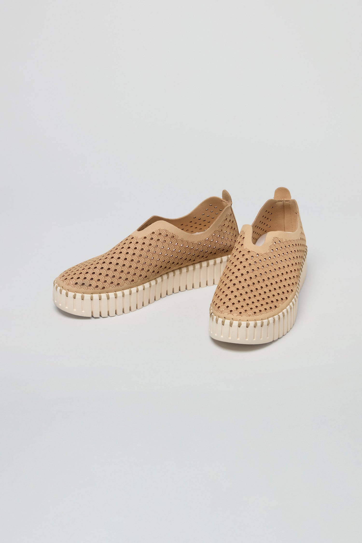 A pair of Latte Tulip Platform Slip On Shoes with perforated recycled microfibre uppers and white textured soles displayed on a plain background.