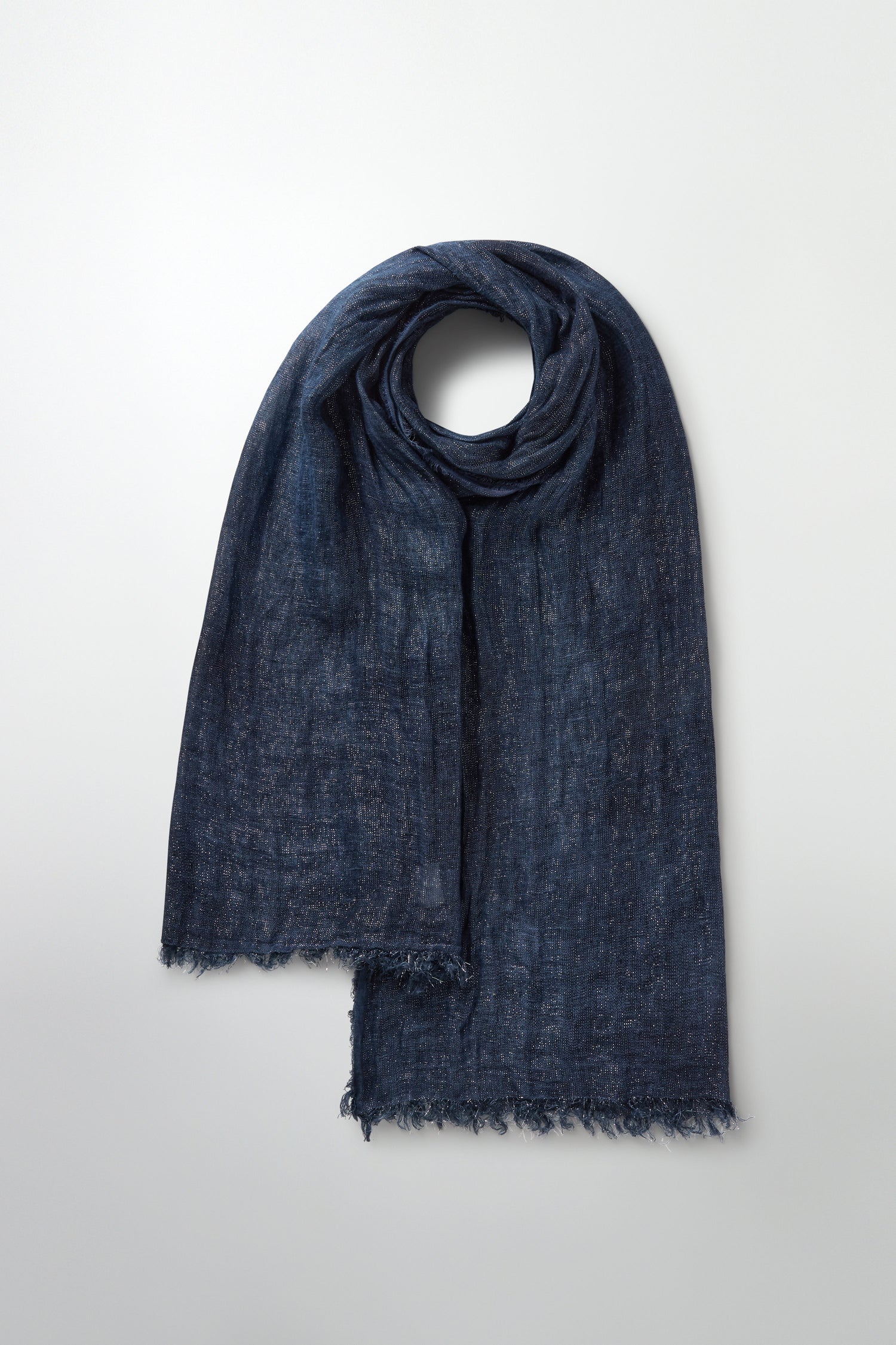 Indigo blue Starry Night Scarf with textured fabric and frayed edges, showcased on a light gray backdrop.