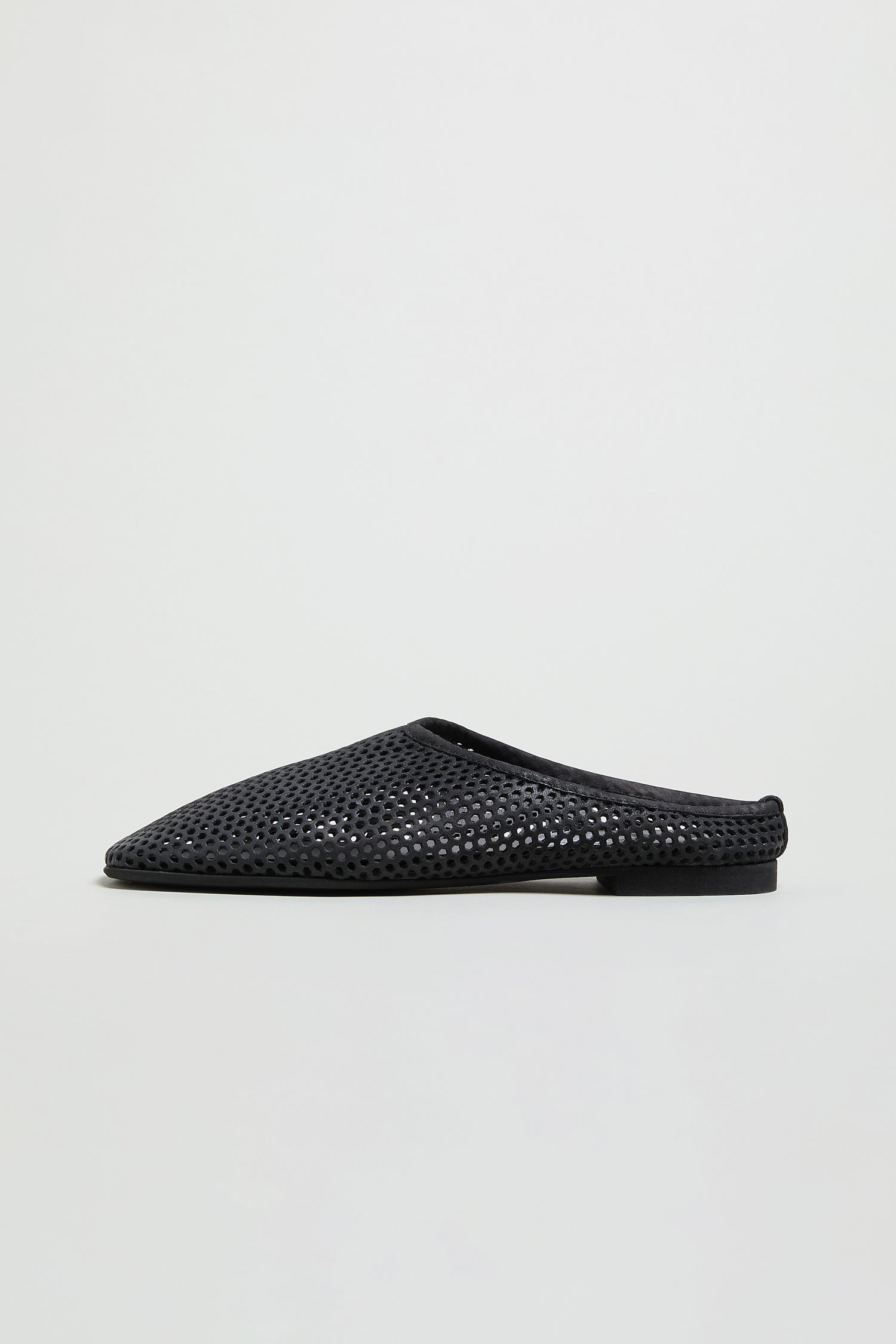 The Mesh Leather Slip on Shoes, a black woven mule with pointed toe and flat sole, are shown in side profile on a plain light background. The LOFI10042 style from SS26 is coming soon.