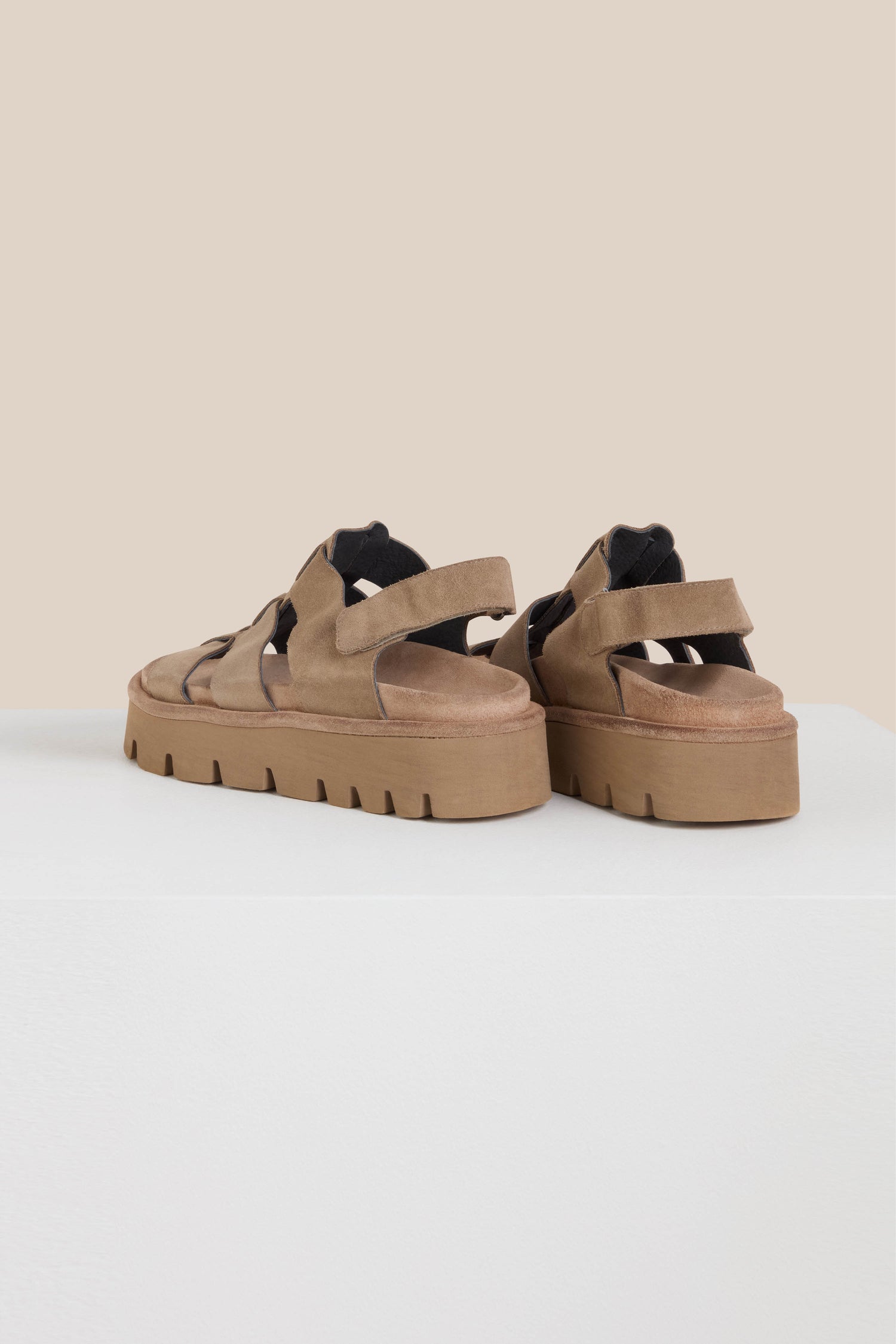 Sahara Italian-crafted Suede Platform Velcro Sandals in brown with multiple straps and black lining, displayed on a white surface against a beige background.