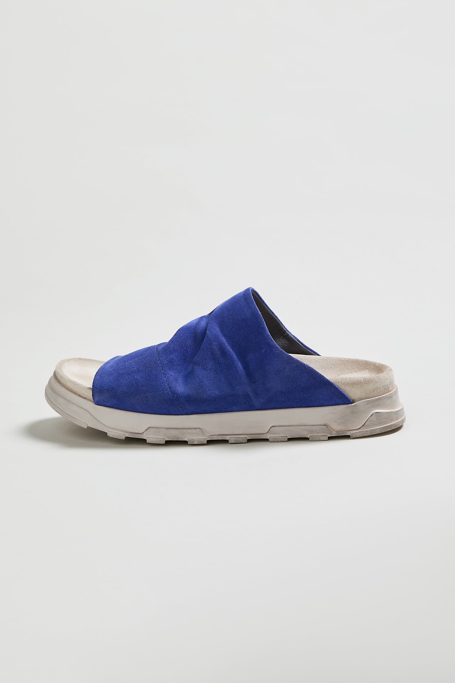 A single Crushed Suede Slider in blue, style LOFI3364, featuring a thick light gray sole, is photographed against a plain light background.