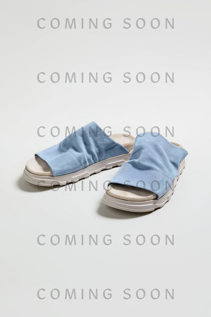 Crushed Suede Sliders in light blue, style LOFI3364, are shown on a white background with "COMING SOON" overlaid—get ready to step into SS26’s must-have look!.