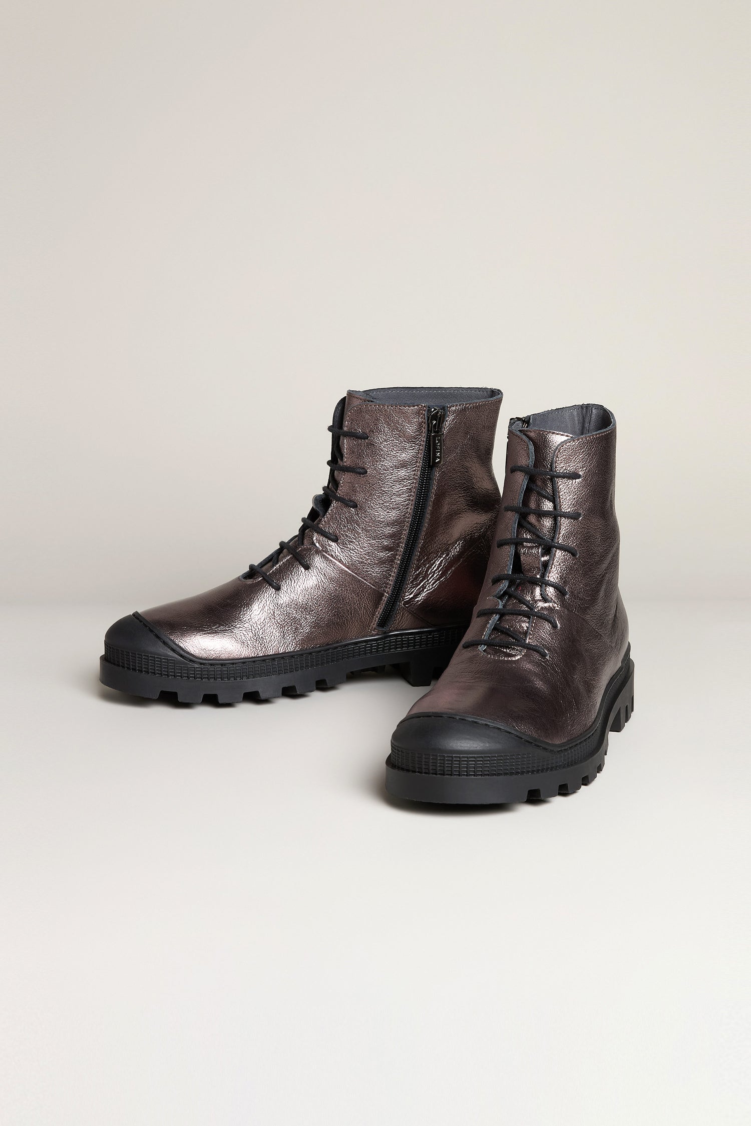 A pair of Rose Metallic Lace Up Leather Boots in dark brown high-grade leather, featuring side zippers and black rubber soles, displayed against a plain background.
