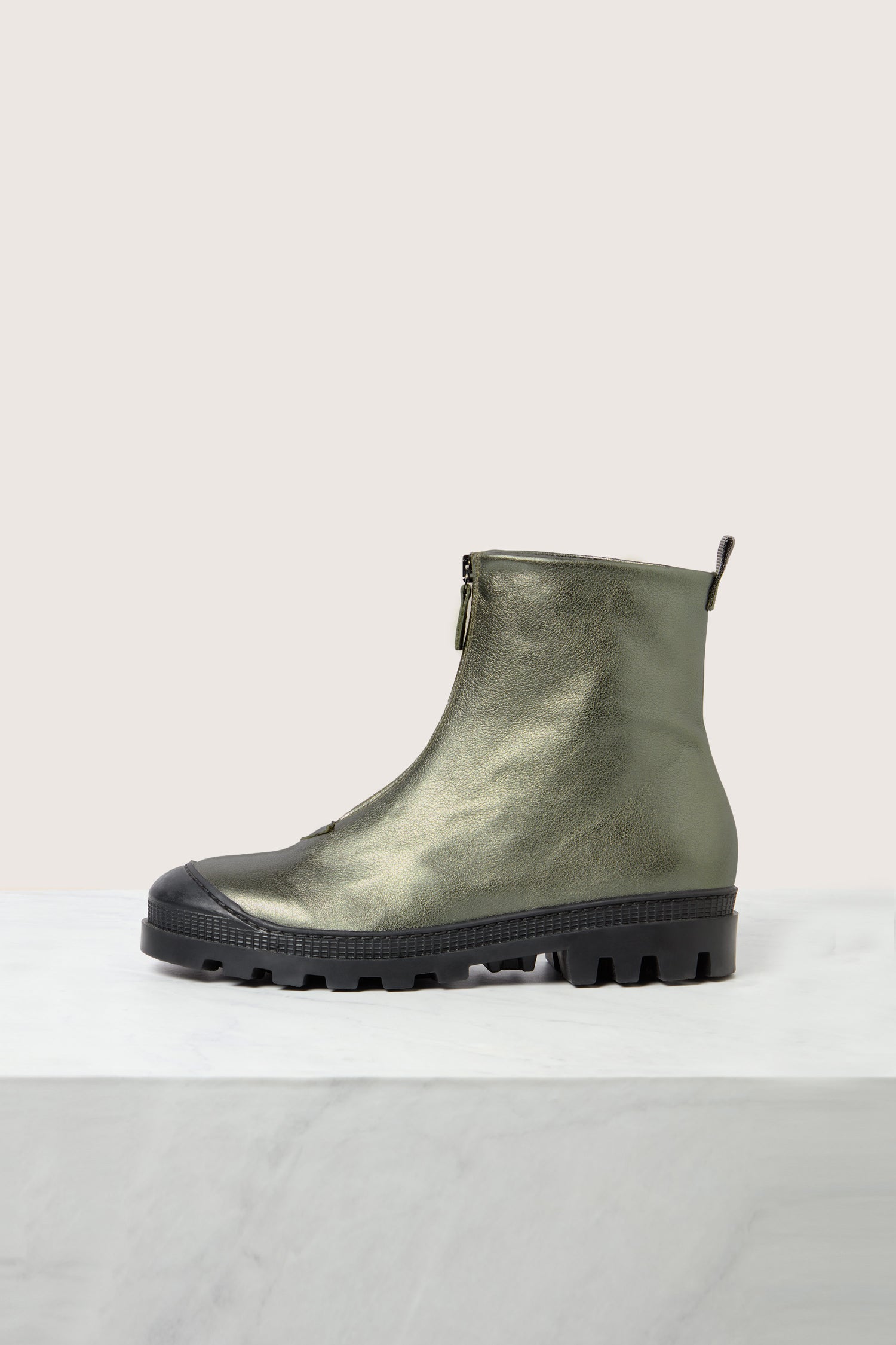 A single Zip Front Leather Boot in green leather with a black rubber sole, showcased against a light background.