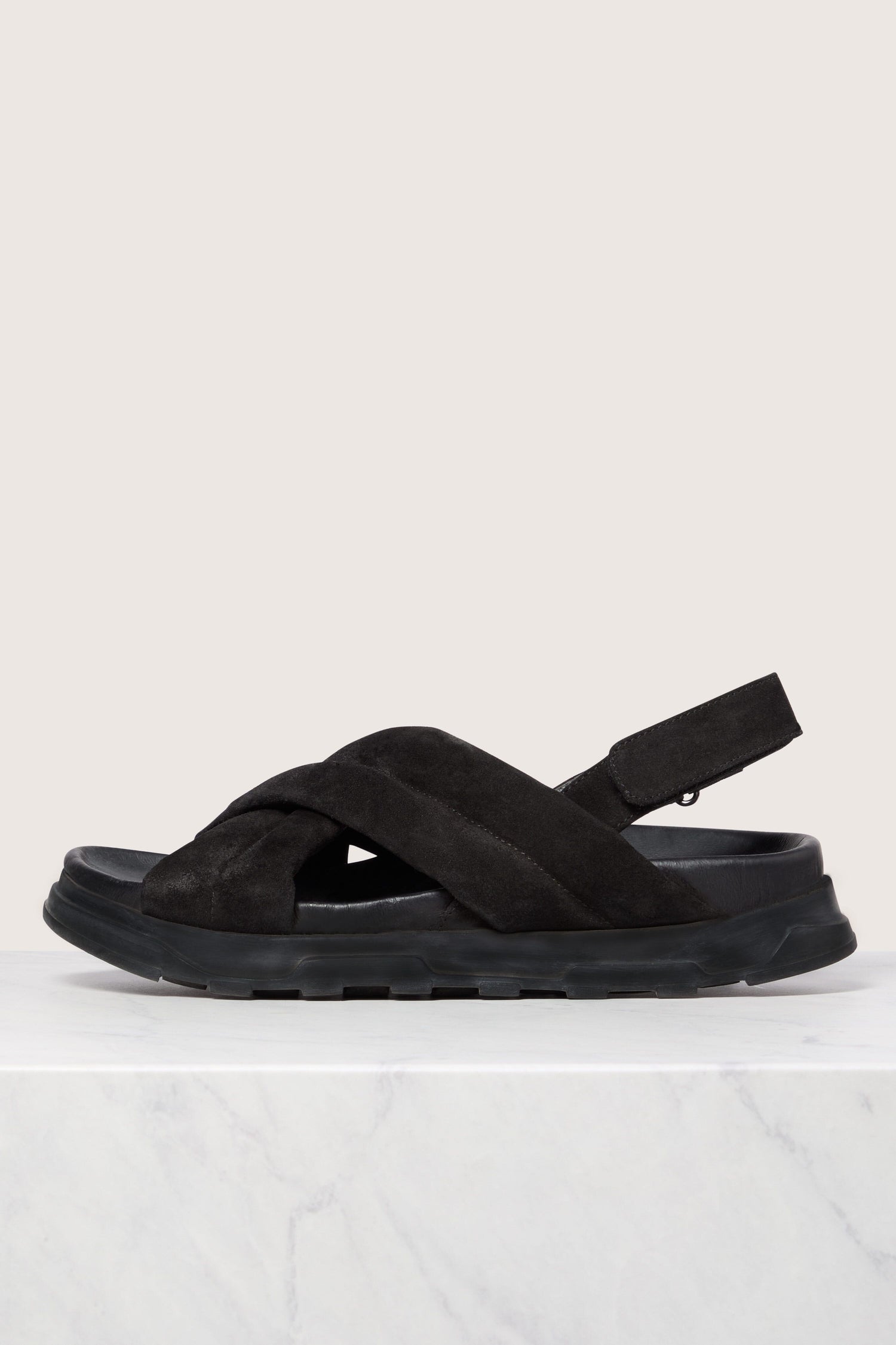 A single black Suede Crossover Sandal displayed against a white background.