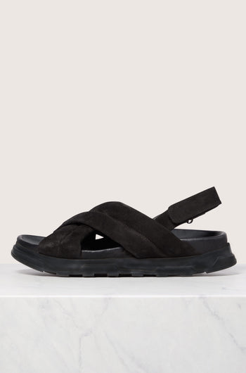 A single black Suede Crossover Sandal displayed against a white background.