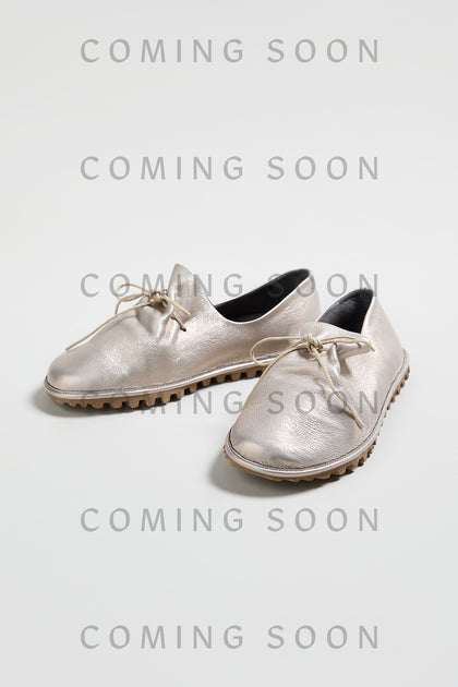 Crushed Leather Lace Up Shoes in metallic silver, style LOFI9944-SS26, with textured soles are shown on a light background. "COMING SOON" is repeatedly overlaid on the image.