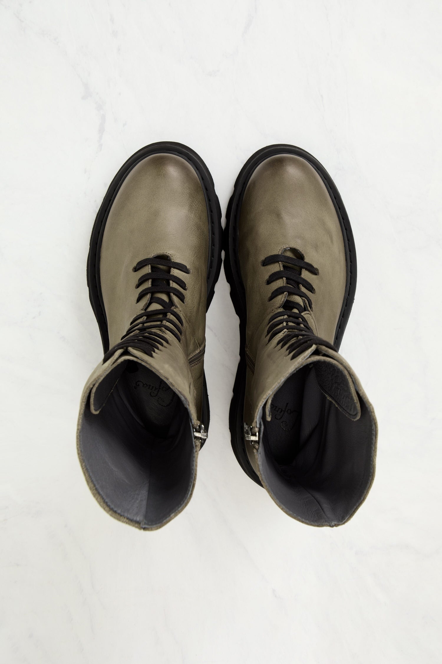 Platform Lace Up Leather Boots, a pair of grey boots showcasing Italian craftsmanship on a marble surface.