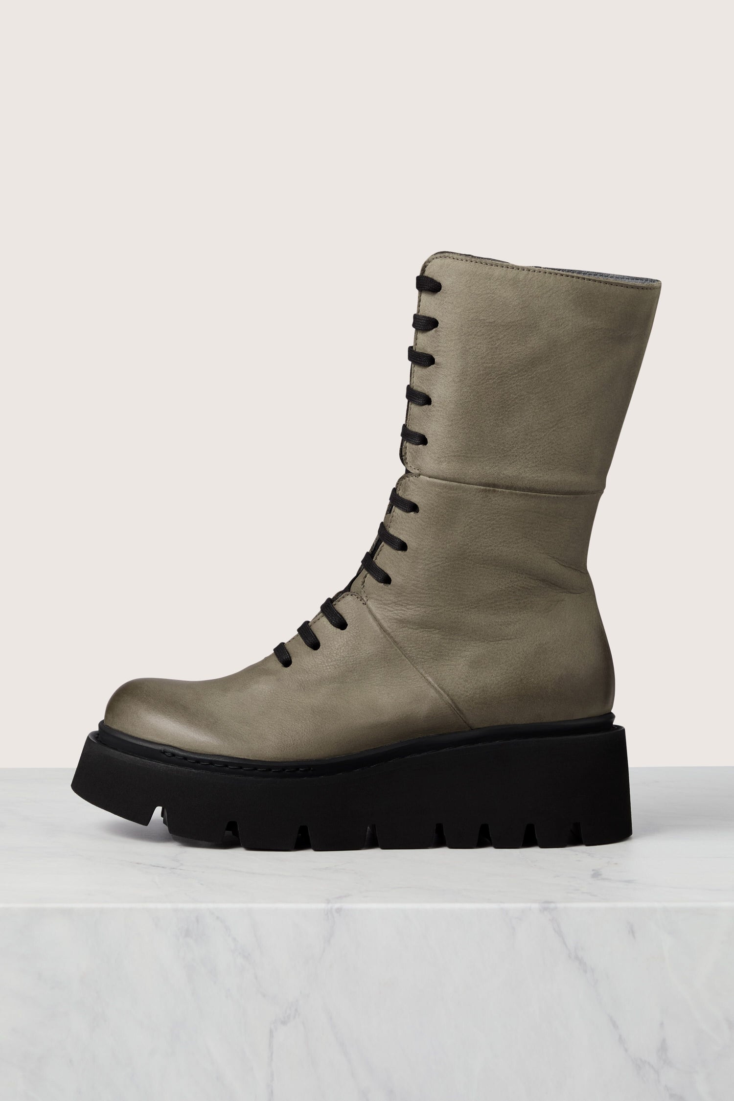 A grey Platform Lace Up Leather Boot with a black outsole featuring Italian craftsmanship.