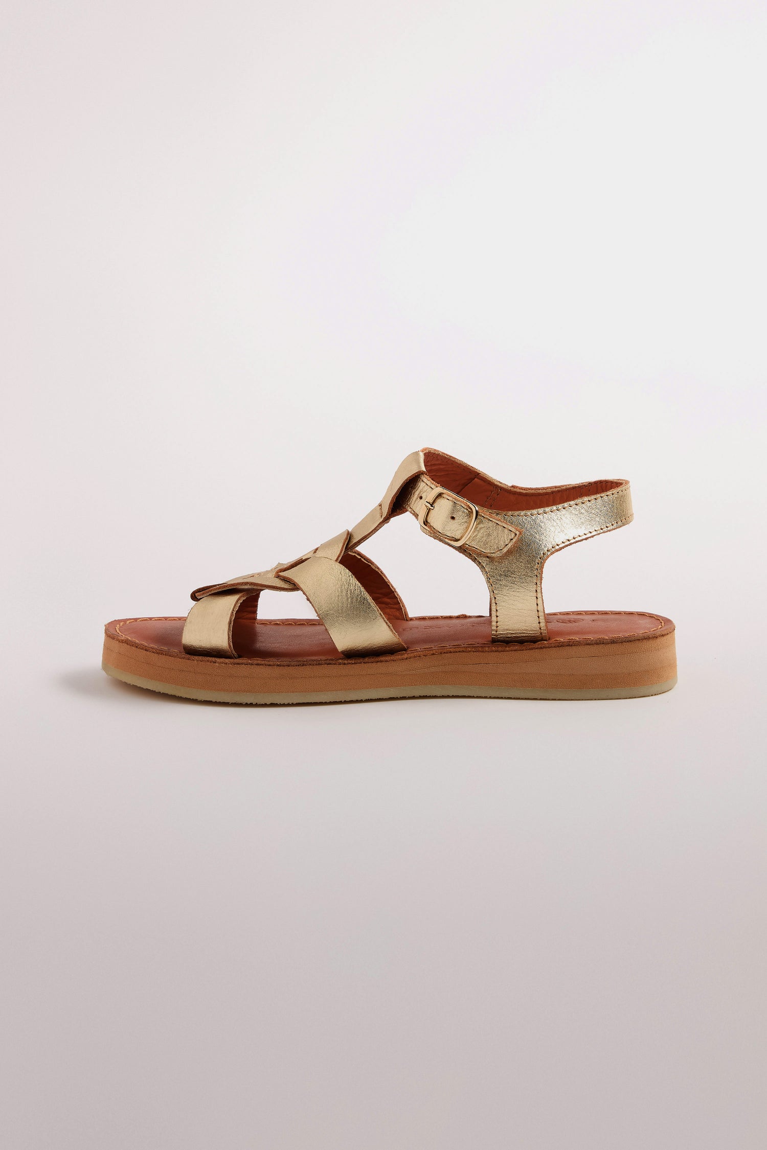 The Tulum Leather Buckle Sandal, crafted from premium gold handmade leather, features adjustable straps and secure buckle fastening, showcased on a neutral background.