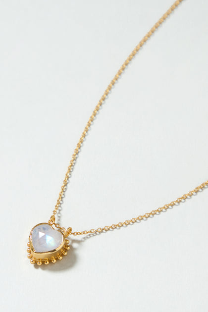 The Gold Plated White Moonstone Heart Necklace adds a touch of elegance to any outfit with its heart-shaped pendant and sophisticated design.