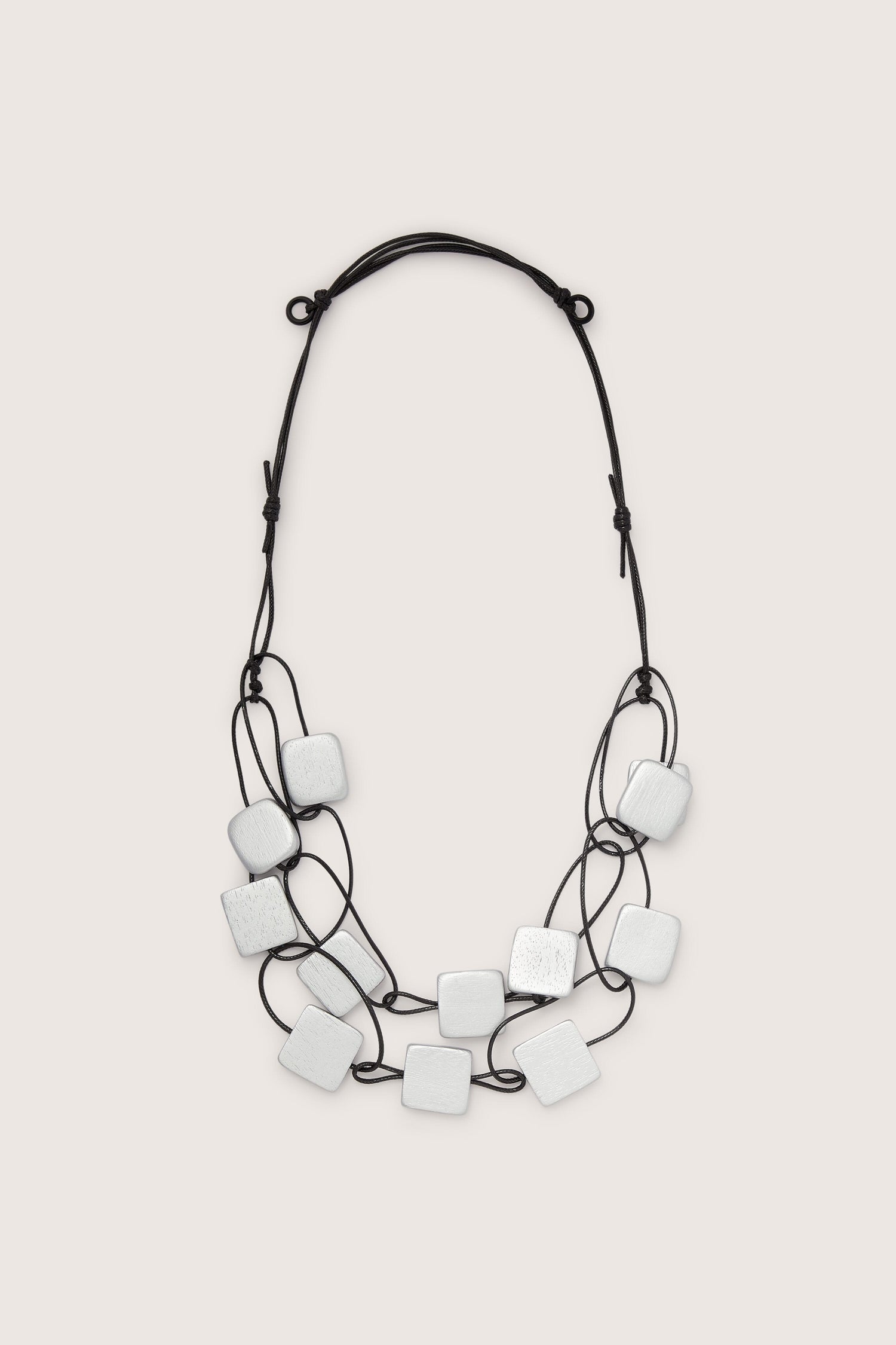 Contemporary Cascade Squares Necklace with brushed silver square pendants on a black cord.