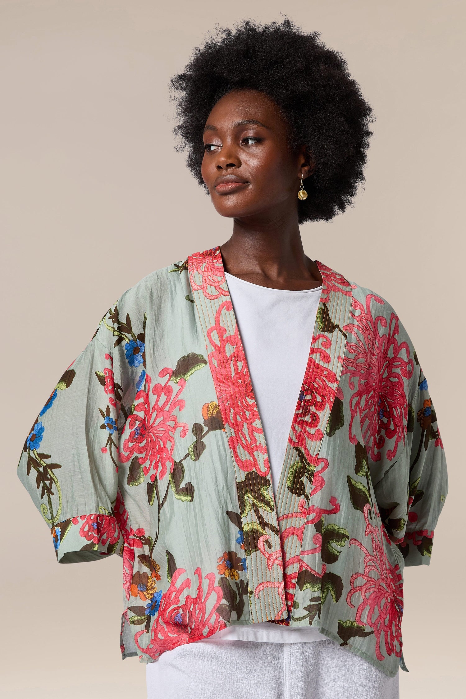 A black woman wearing a Chrysanthemum Kimono.