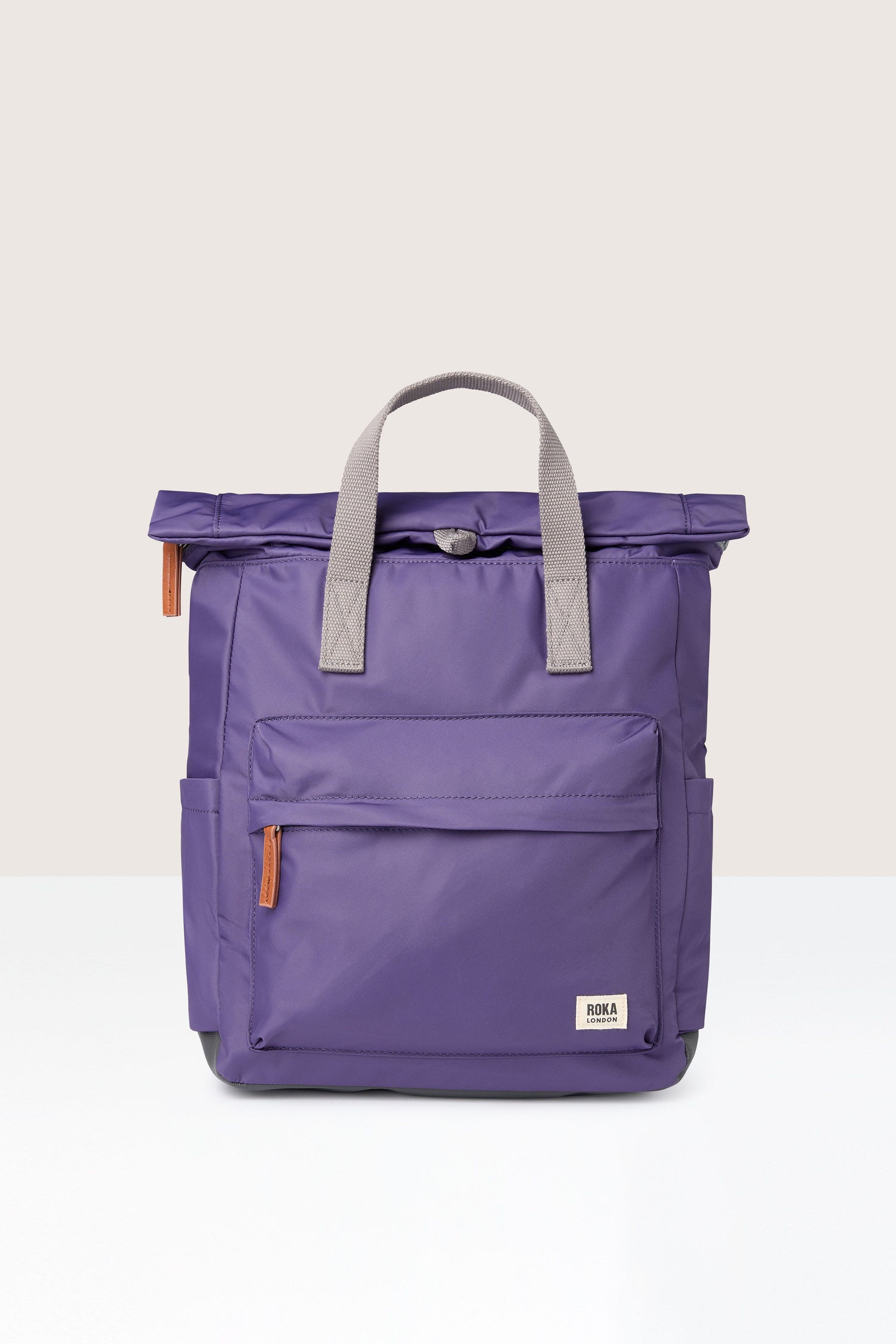 A weather-resistant Recycled Canfield Bag with grey handles.