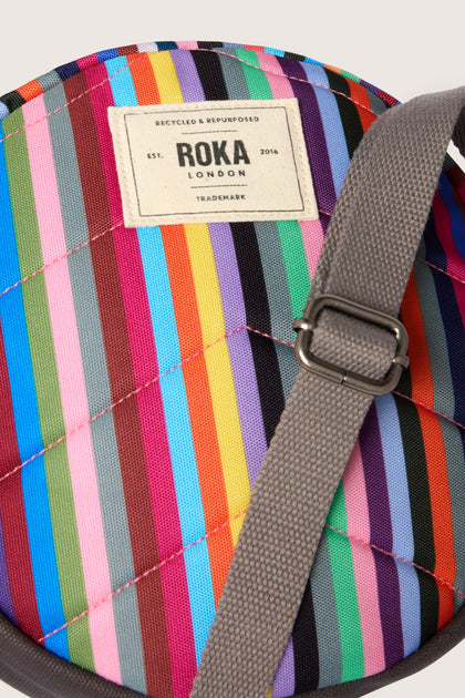 Lightweight Recycled Canvas Paddington Bag in vibrant rainbow stripes.