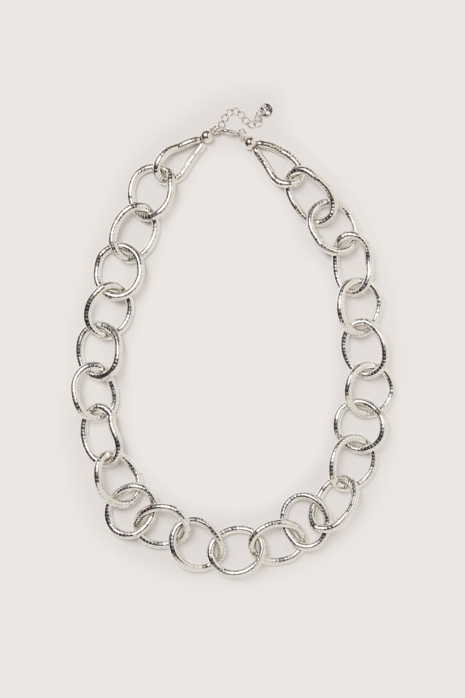 A classic Long Silver Links Necklace with a fresh sheen, showcased on a white background.