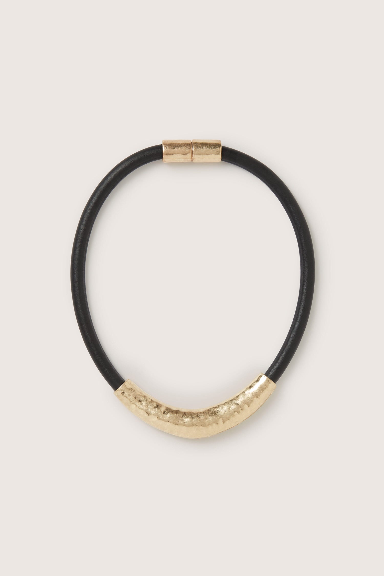 A black leather bracelet with a Hammered Necklace clasp.