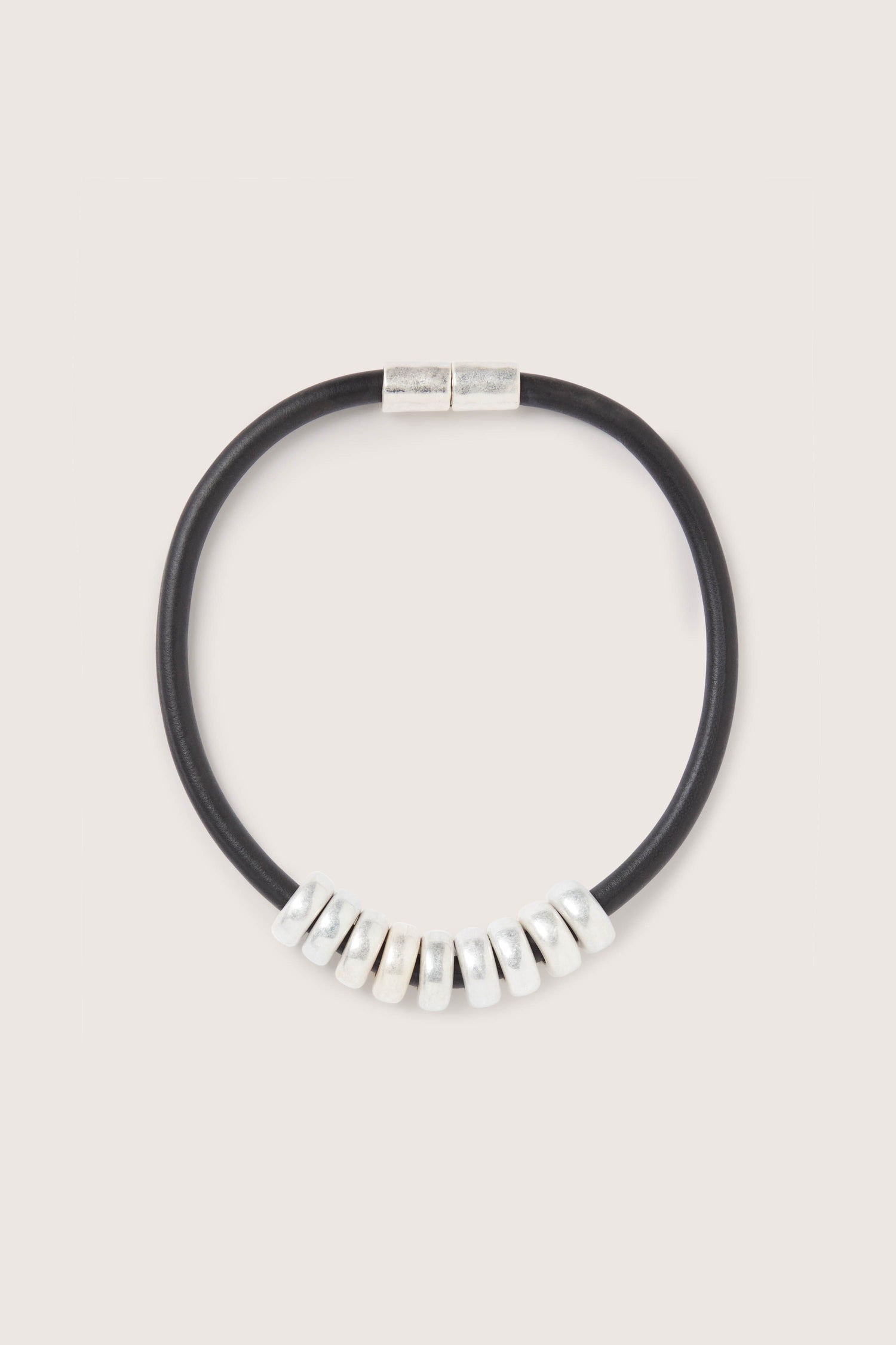 A black leather choker with Hammered Silver Cyclinders Necklace.