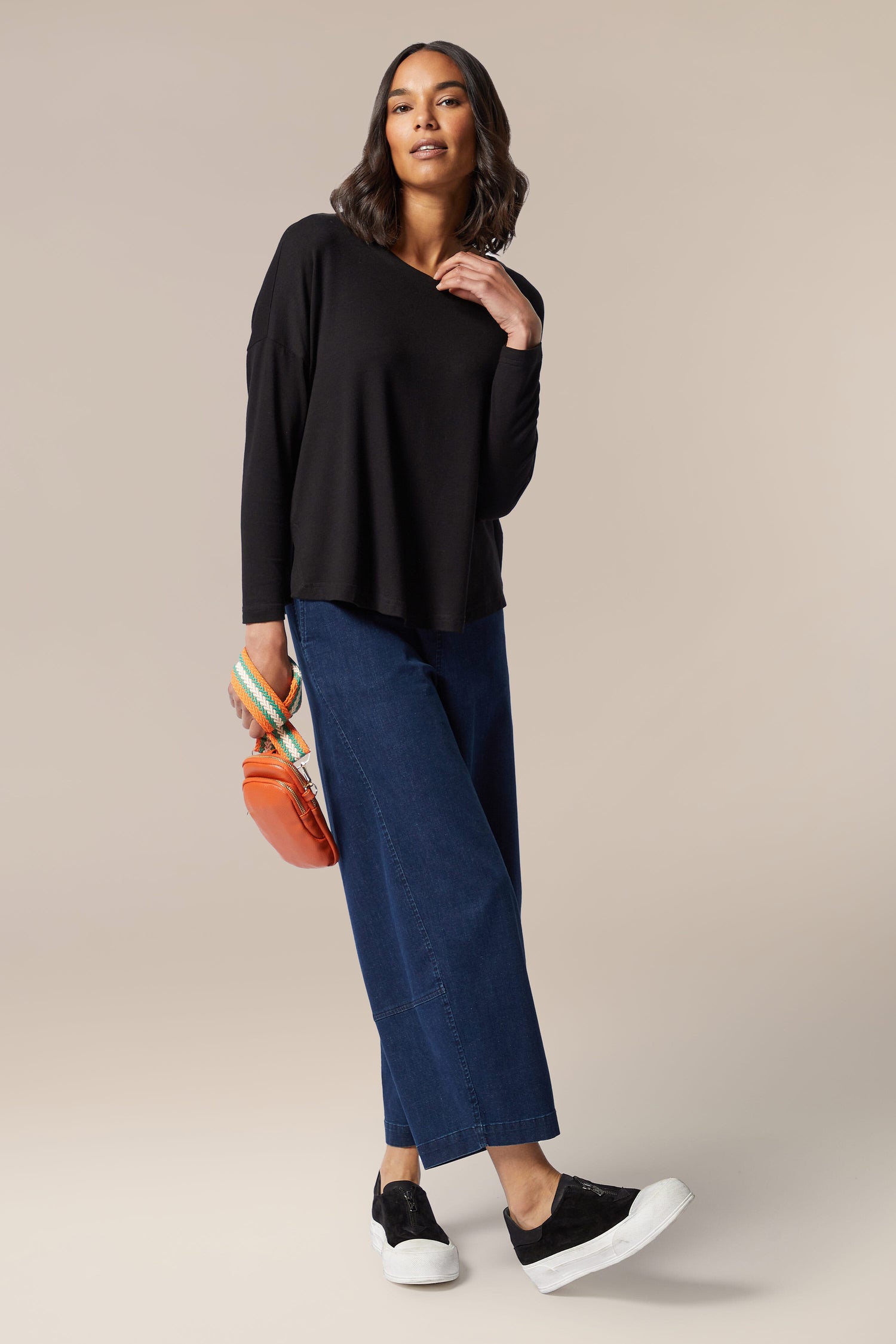 The model is wearing a Fluid Crepe Relaxed Top.