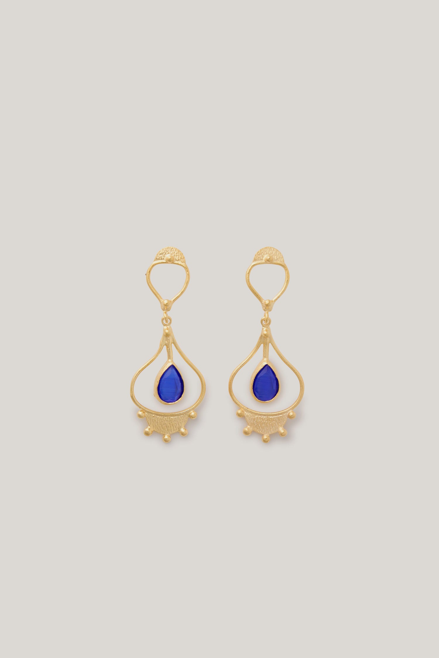 Handcrafted Teardrop Earrings with blue stones, created by artisans.